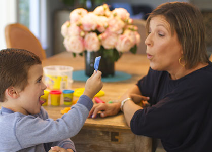 Elise Duryea working with child